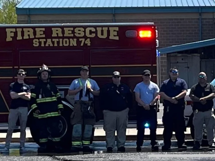 EMS personnel from Goshen Volunteer Fire Company posing in front of the ambulance