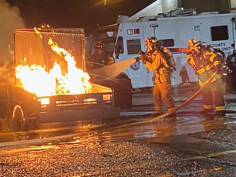 Firefighters from Goshen Volunteer Fire Company putting out a fire